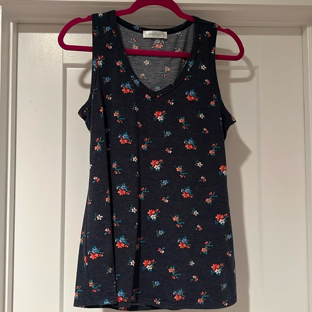 Beautiful navy blue tank top with floral print and flattering V-neck